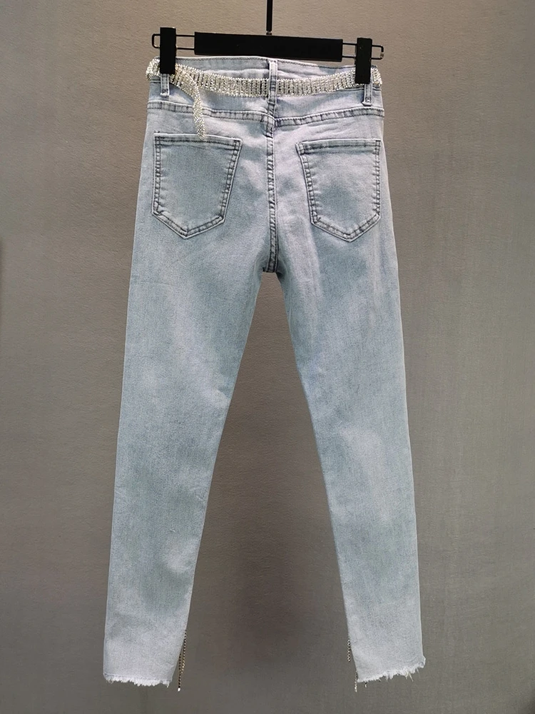 Джинсы женские облегающие синие тонкие эластичные с кисточками обтягивающие