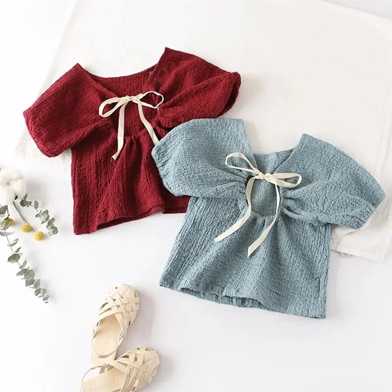 

Детская одежда, футболки для девочек 2-7 лет, летние новые корейские топы с пышными рукавами для малышей, модная футболка с открытой спиной и ...