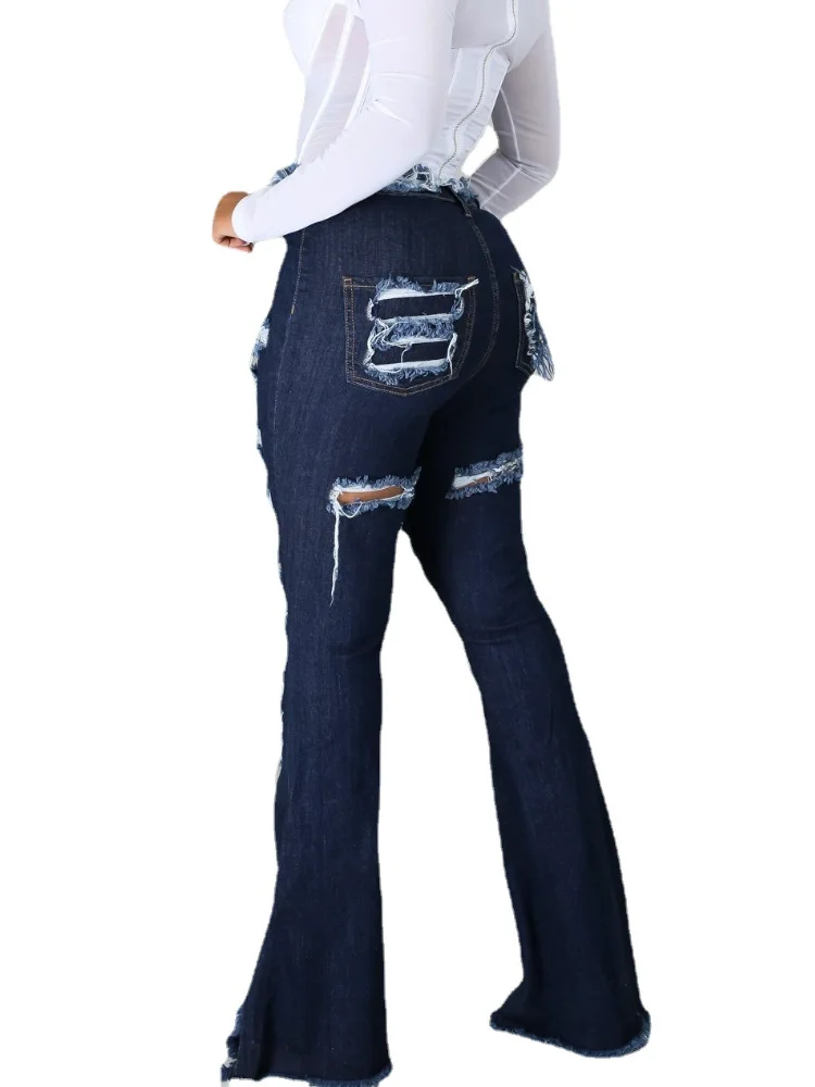 Джинсы женские рваные расклешенные с высокой талией дырки в джинсах |