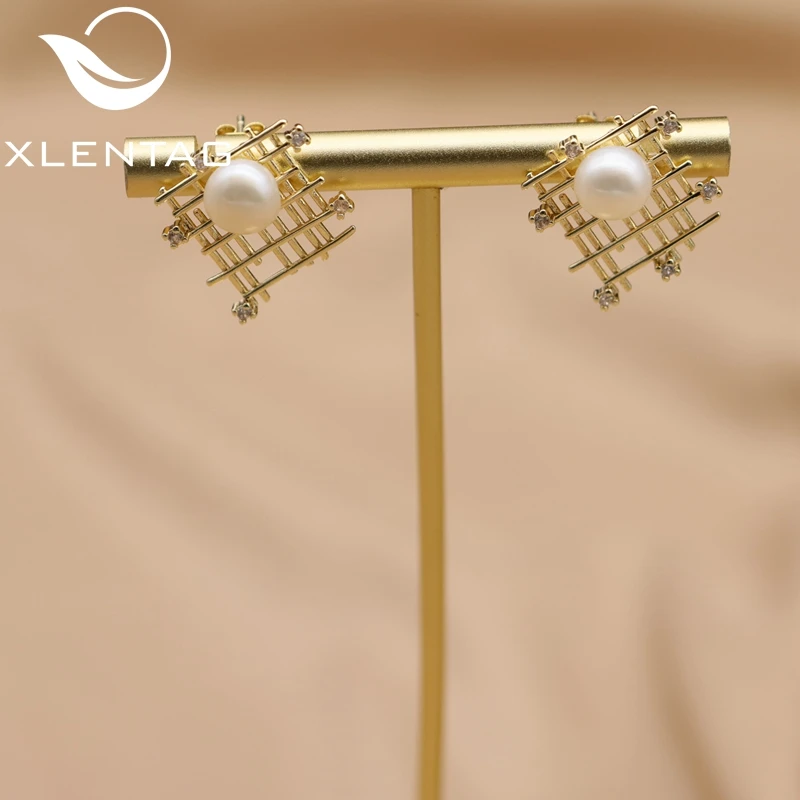 

Xlentag Brass Gold-Plated Hollow Mesh Freshwater Pearl Earrings Women Fashion Exquisite Quality Jewelry Ge1012