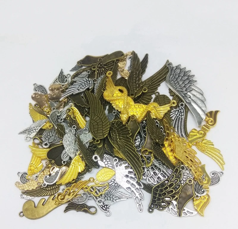 100 граммов в упаковке смешанпосылка из сплава виде крыльев и перьев для легких