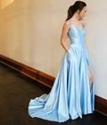 Длинные трапециевидные светильник Синий Выпускные платья с карманами с ремешками сзади; Robe De Soiree пол Длина Атлас официальная Вечеринка платье для Для женщин