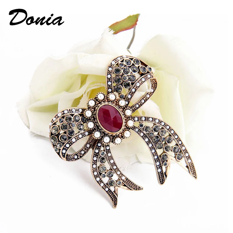 

Donia jewelry Fashion trend jewelry ancient red bronze hollow imitation pearl imitation gemstone bow lady coat brooch scarf pin