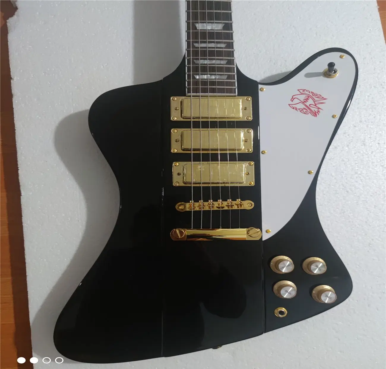 

High quality Firebird electric guitar, black body neck integration mechanism, customizable, free transportation