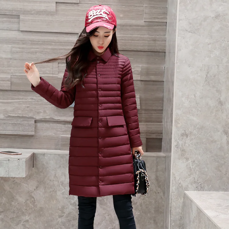 Пуховик женский осенне-зимний приталенный средней длины с отложным воротником