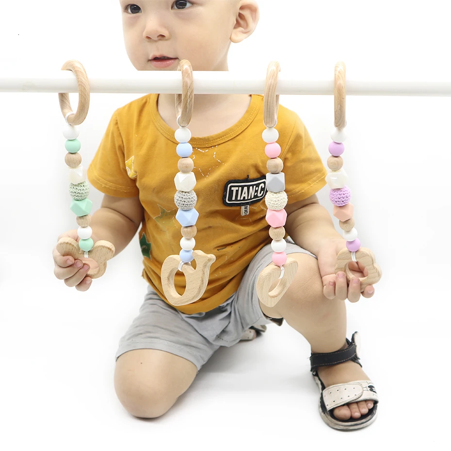 

Baby Wooden Chain Chewable Bracelet Baby Mobile Wooden Teether Leaf Baby Gym Rattle Toy Chew BPA Free Baby Teething Infant Gifts