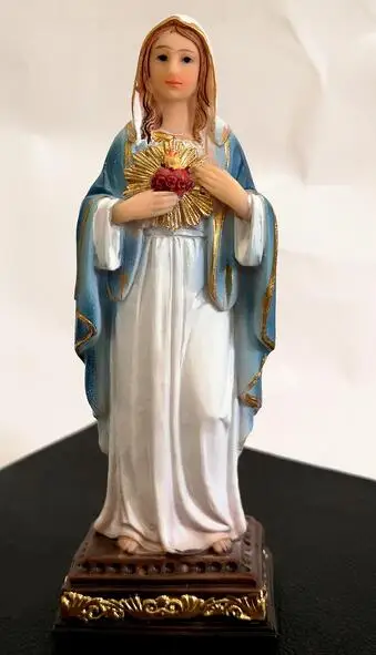 

angel figure the virgin touched the sacred heart statue of Mary placed prayer cart with Catholic holy object of Jesus Christ