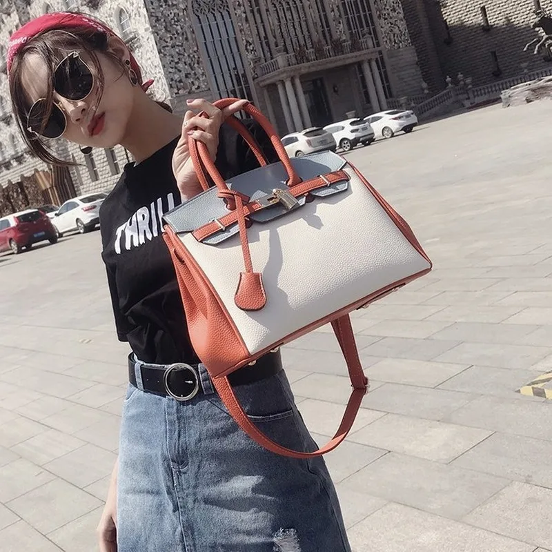 

Women's Bag 2020 new zipper bag European and American women's bag lychee-print platinum bag sloping across the shoulder tote bag