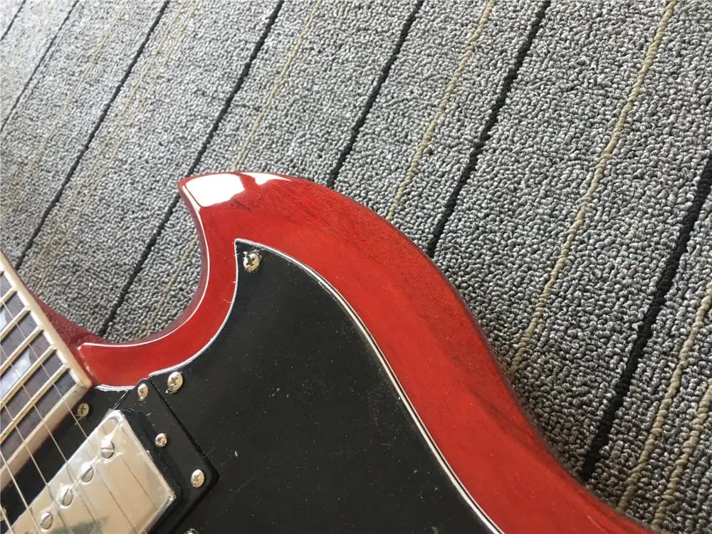 Китайский продукт Красная гитара Блочная инкрустация Бесплатная