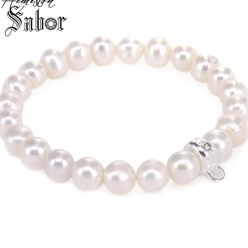 Браслет с белым пресноводным жемчугом и подвеской-переноской | Украшения