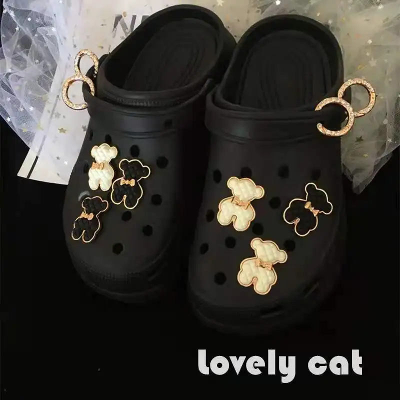 

Cute Elegant Black and White Texture Bear Croc Charms Lovely Pearl Chain Bundle Decoration Shoe Flower Croc Charms Designer