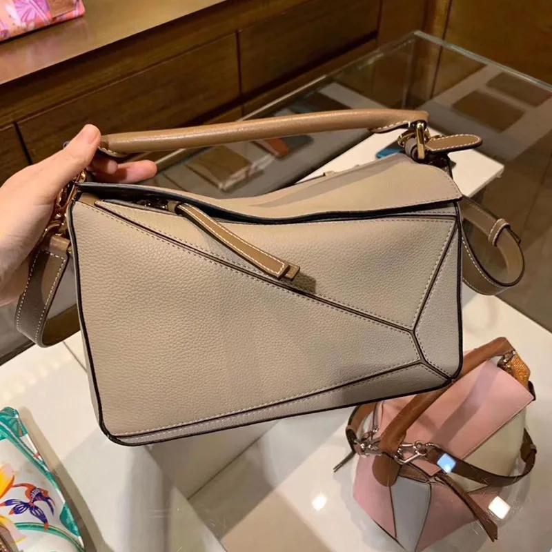 

2021 new fashion same style geometric bag stitching leather female bag messenger big bag pillow bag puzzle women's handbag