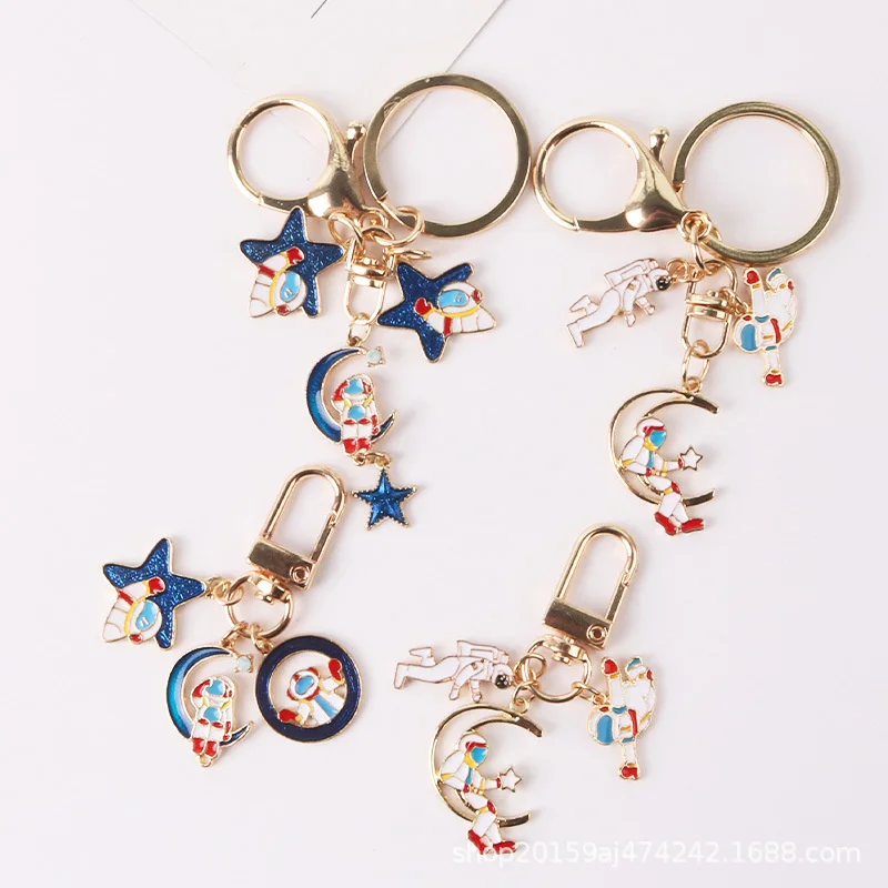 

Симпатичный креативный брелок для ключей, много видов Подвесок в виде астронавта, ярлык, аксессуары для пар, аксессуары для колокольчиков, и...