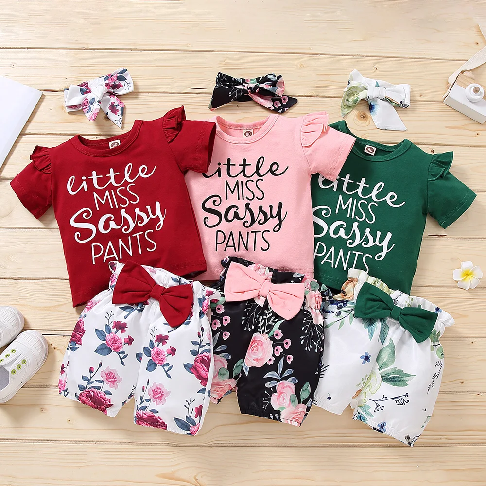 

Summer Short Sleeved Girls' T-shirt Set Round Neck Shorts Flower Letter Bow Scarf is Suitable for Girls Aged 1-5