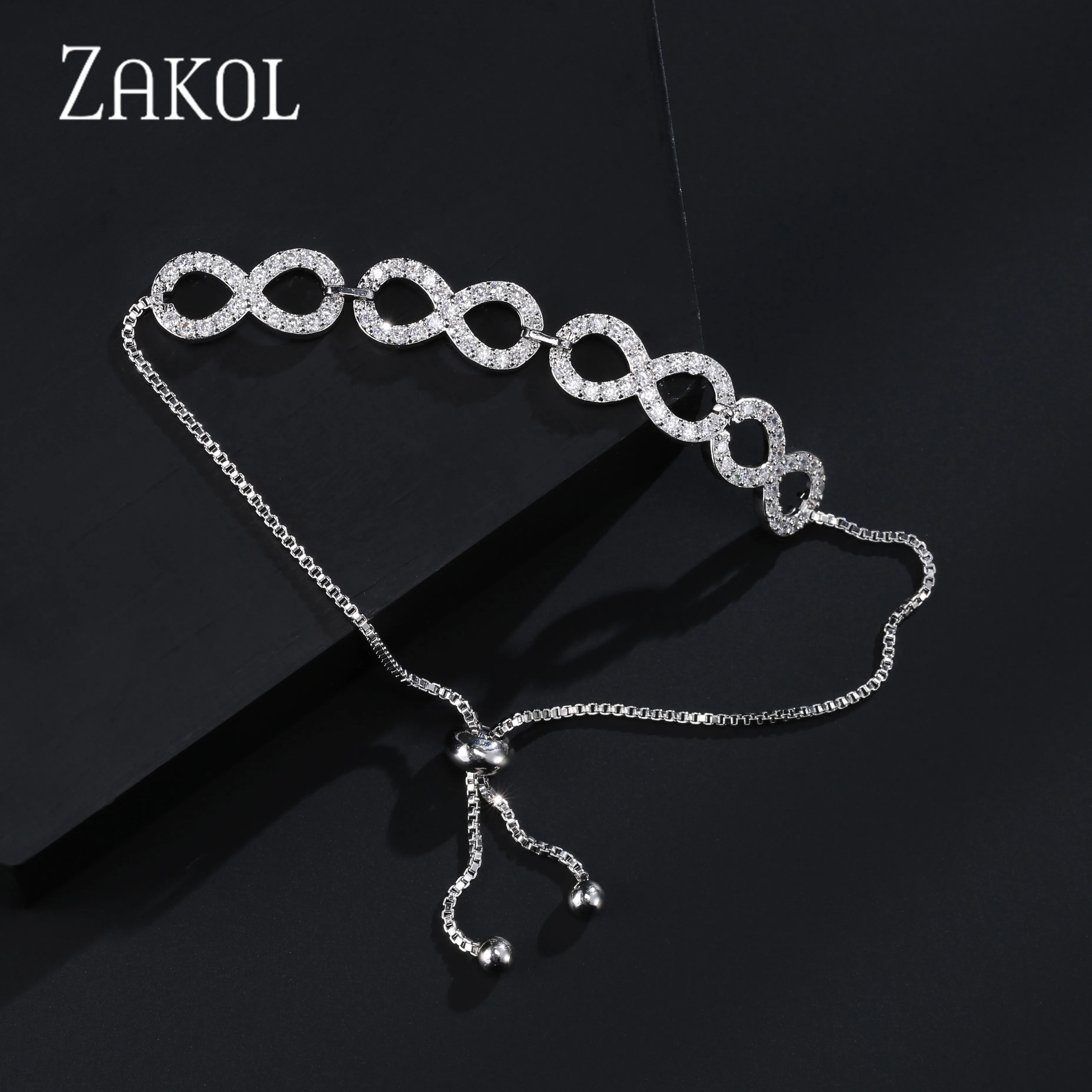 Женский браслет ZAKOL регулируемый на шнурке с кубическим цирконием 8 форм для