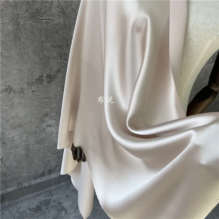 Ацетатная атласная ткань цвета шампанского и бежевого гладкая блестящая для