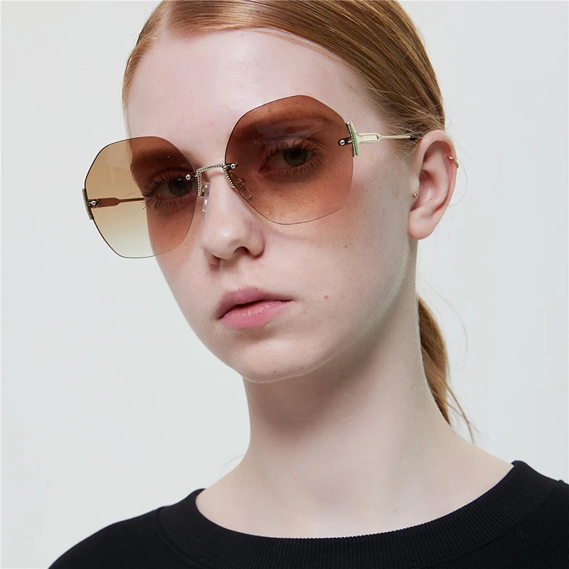 

Free shipping 2021 Frameless Multilateral Round Sunglasses Retro Glasses Rhombic Frameless Sunglasses for Women