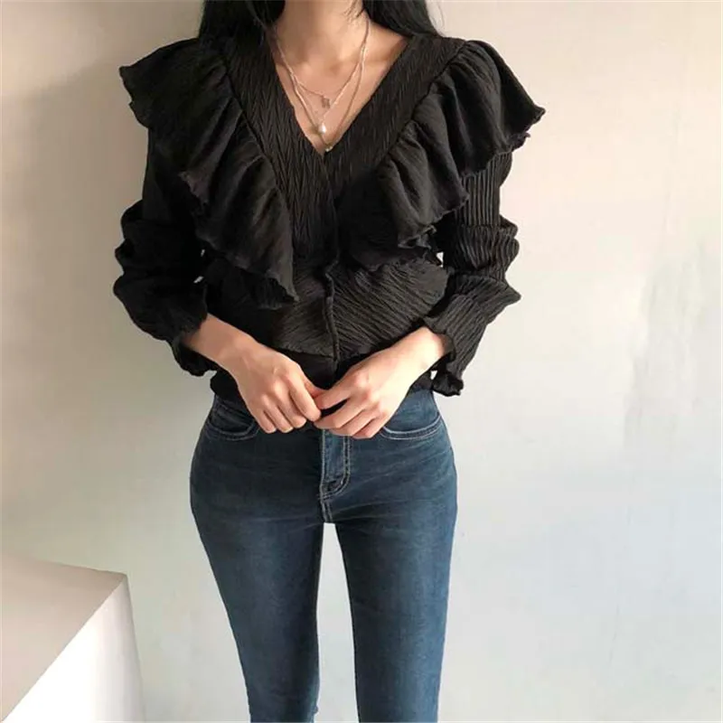 

RUGOD 2021 spring gentle and thin V-neck wrinkled texture ruffle stitching high-waisted flared sleeve shirt top women