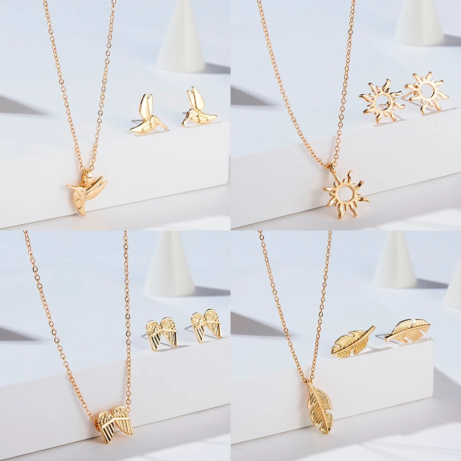 Комплект из колье и серёг золотистого цвета с подвеской в виде крыльев