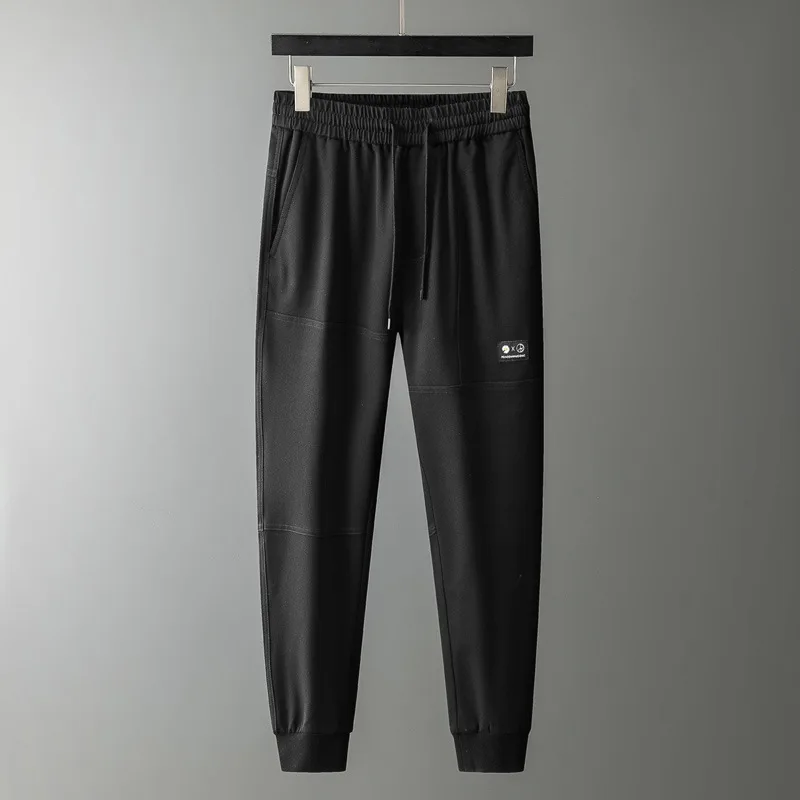 

European style 2021 spring new fashion men's pants chrysanthemum embroidery pattern versatile casual sports pants