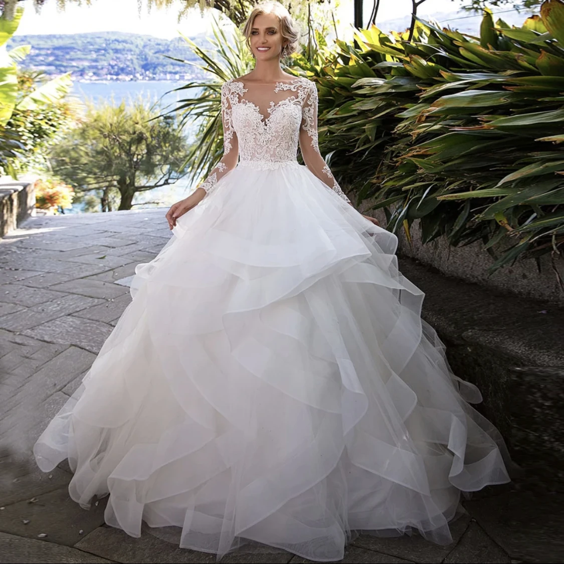 

Gorgeous Princess Wedding Dress 2021 Tiered Sheer Neck Long Sleeve Lace Appliques Sweep Train Bridal Gown Vestidos De Noiva