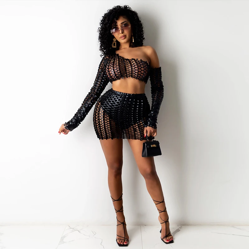 

Kricesseen Sexy Fishnet Hollow Two Piece Skirt Set Women Summer One Shoulder Long Sleeve Top And Mini Skirt 2 Pieces Outfits