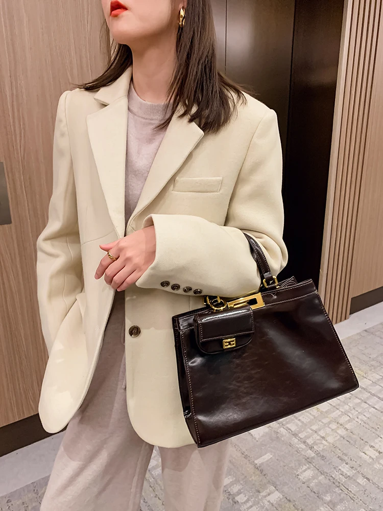 

Real Cowhide Baby Cat Bag 2021 New Trendy Messenger One-shoulder Portable Fashion Commuter Briefcase Purses and Handbags Luxury