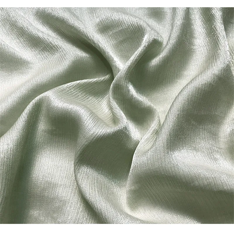 

CF932 Crinkle Cloth Silk Linen Shiny Light Green Luxury Ripple High-ranking Custom Fabric Illuminant Elastic Fabric For Women