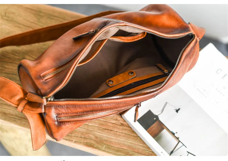 

PNDME vintage natural real cowhide cylinder design men's personality chest bag outdoor daily genuine leather youth crossbody bag