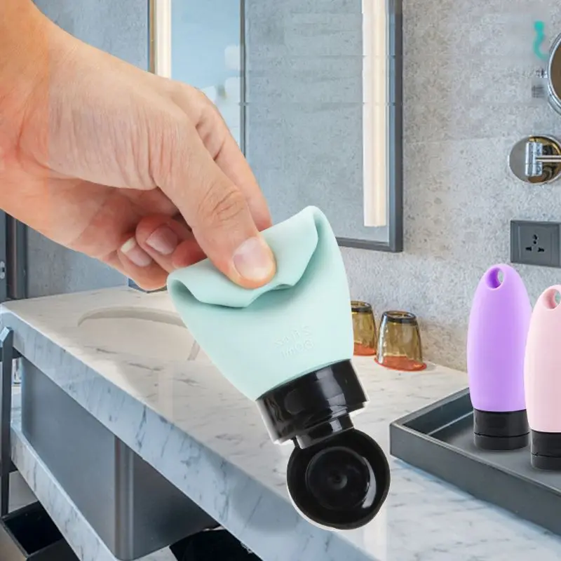 

3Pcs 60ml Portable Silicone Squeezable Empty Travel Bottle with Keychain Carrier