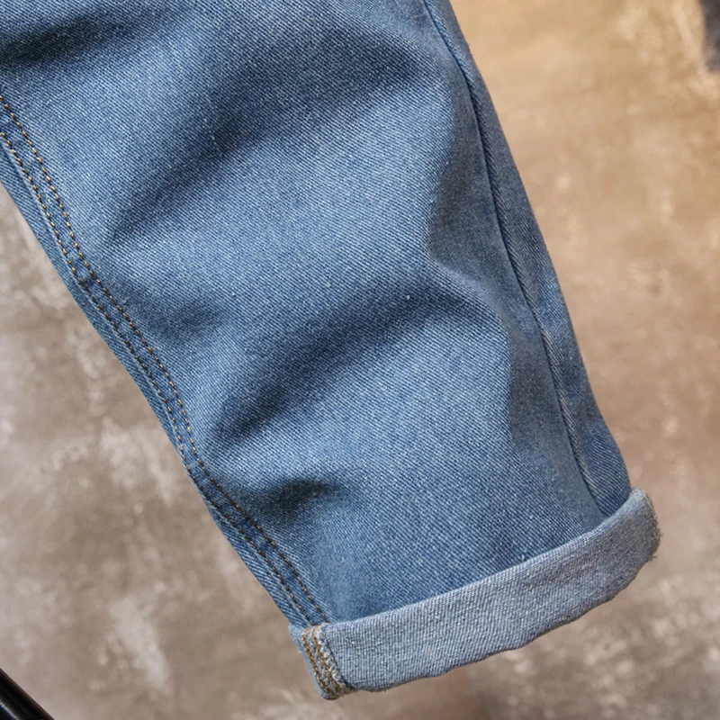 Узкие локомотивные потертые брюки рваные европейские и американские мужские