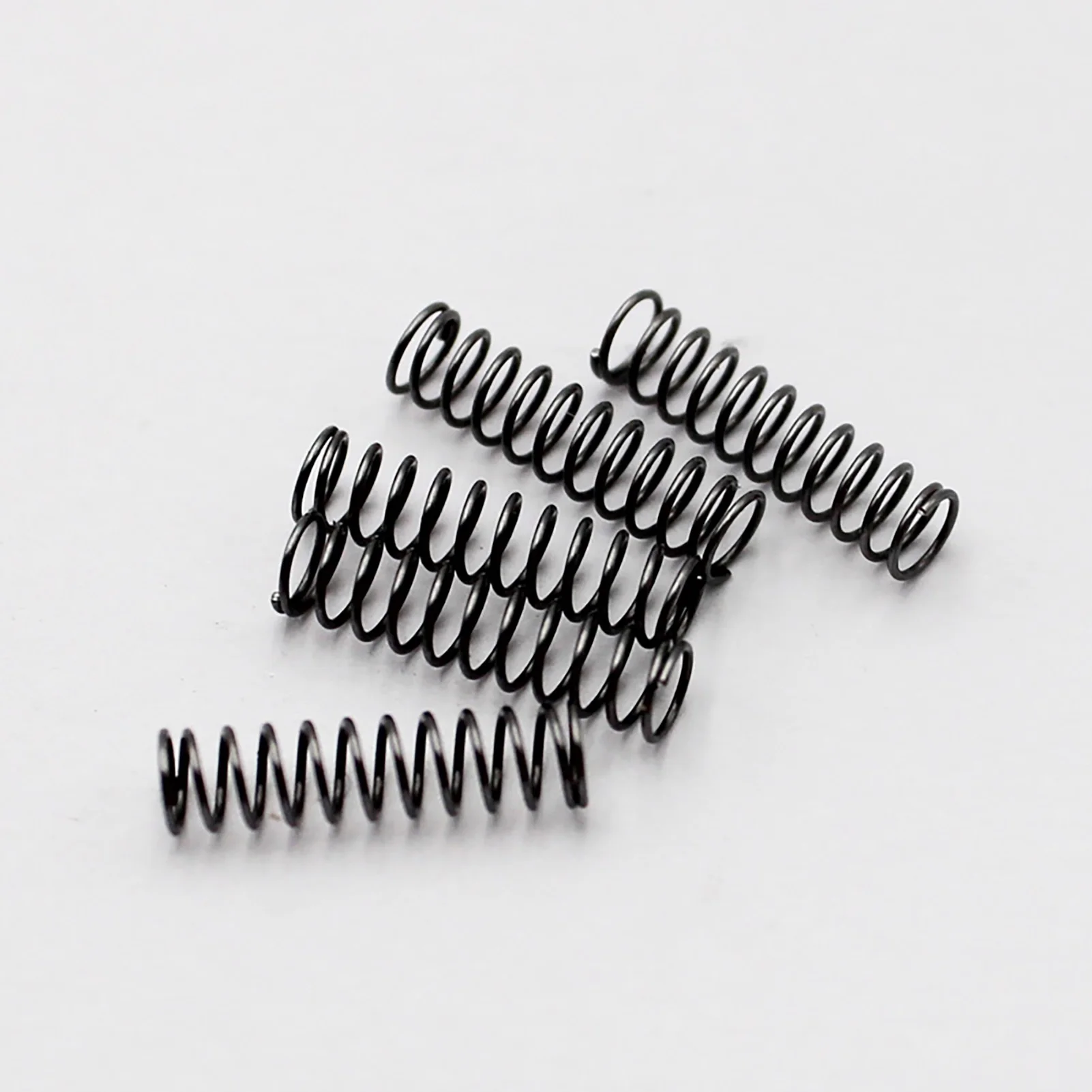 

1.5x13mm Compressed Springs, 1.5mm Wire Diameter x 13mm Outer Diameter x (15-50)mm Free Length, Spring Steel Extension