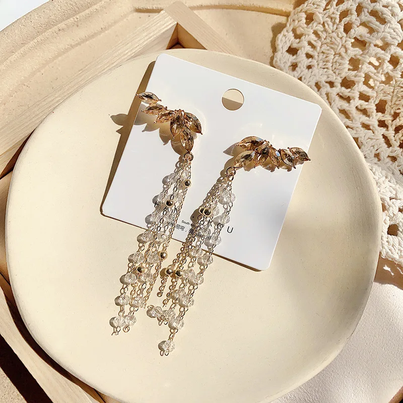 

Korean angel wings palace super fairy temperament long tassel pendant exaggerated thin face S925 silver needle fashion personali