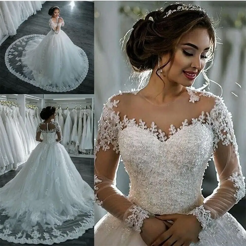 

Dubai Elegant Long Sleeves A-line Wedding Dresses Sheer Crew Neck Lace Appliques Beaded Vestios De Novia Bridal Gowns with Butto