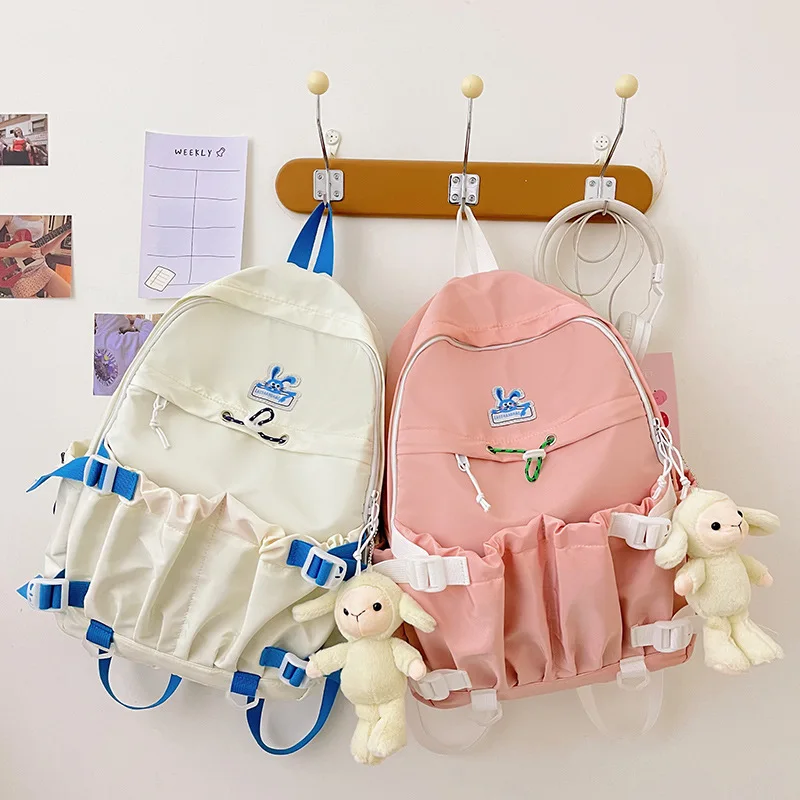 

Japanese girl cute backpack cartoon solid color simple nylon cloth student back pack junior high school school bag 2022