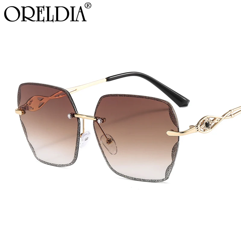 

Fashion New Personality Sunglasses Ladies Metal Frameless Embedded Crystal Decoration Ladies Gradient Color Sunglasses Hot UV400