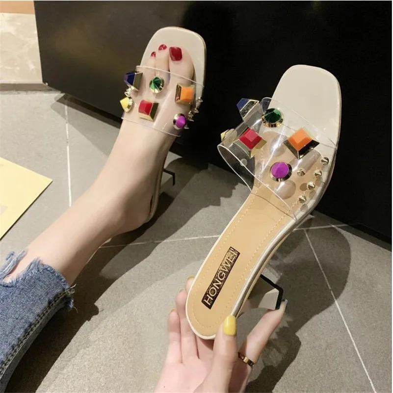 

Recommended summer new high-heeled sandals candy rivets slippers female transparent word drag rough with square head sandals