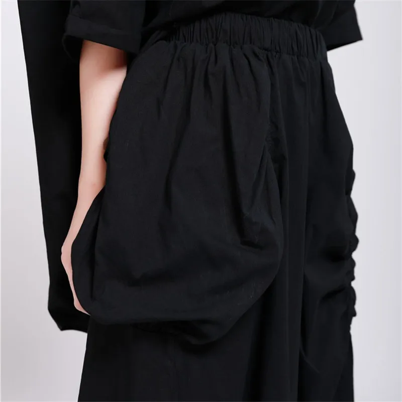 

Women's Irregular Wide Leg Pants Pockets with Elastic Waist Trousers Casual Loose 2020 New Arrival Calf-length Pleated Pant