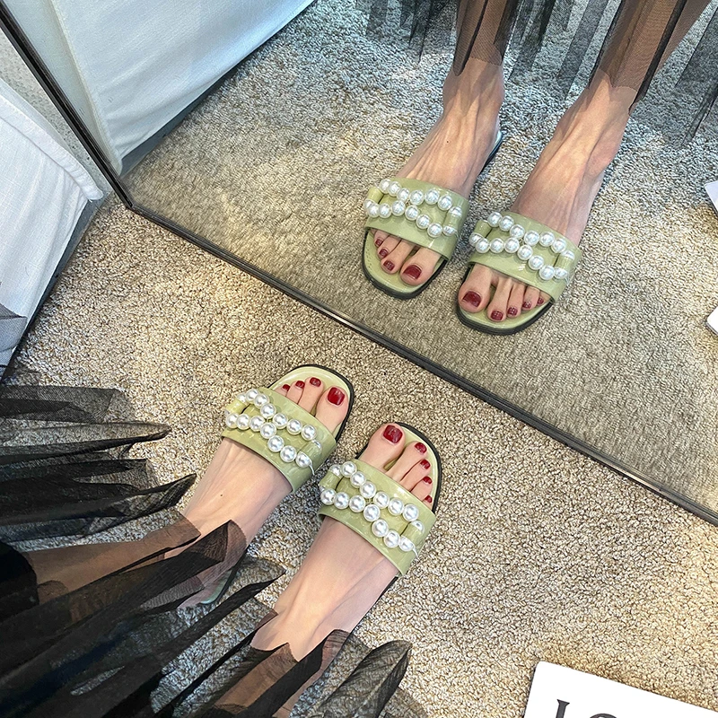 

2021 Korean version of the new niche ins minimalist pearl models all-match external slippers summer bow fashion sandals