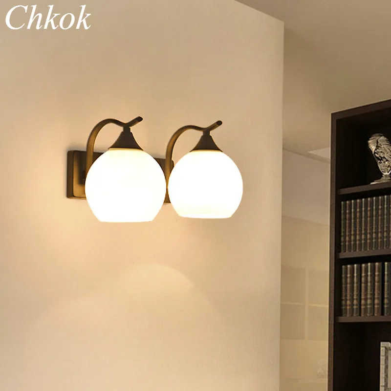 

Modern wrought iron wall lamp LED wall lamp bedside lamp bedroom living room TV background wall lamp glass lampshade