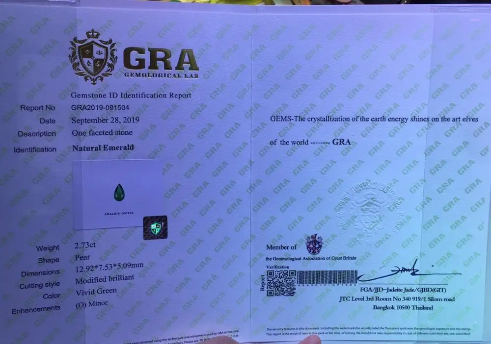 Женская подвеска из 18-каратного золота с натуральным изумрудом карата |