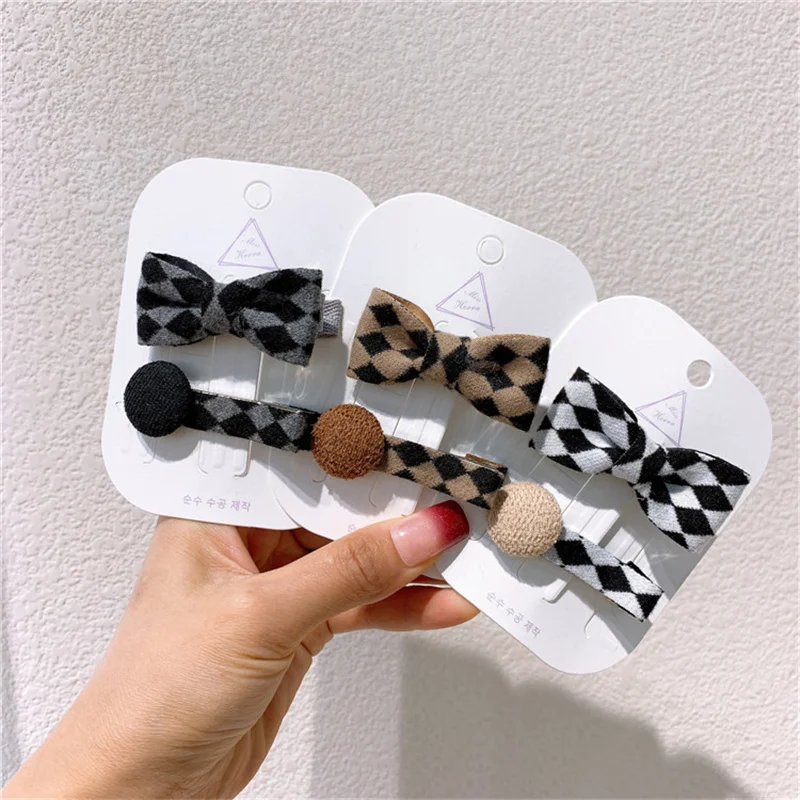 

Новинка, заколка для волос в клетку с бантом, боковой зажим с пуговицами для девочек, простой головной убор, детский зажим для волос, модные а...