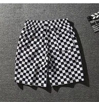 mens summer fashion week street shot the same checkerboard personality shorts black and white checked shorts