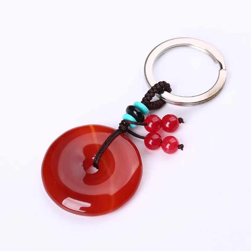 

FYJS Unique Silver Plated Circle Handmade Weave Round Hollow Red Agates Key Chain Ethnic Style Jewelry
