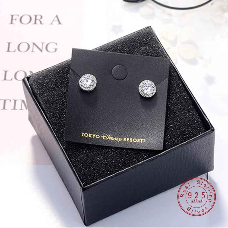 Женские серьги гвоздики серебряного цвета с круглыми кристаллами и фианитом