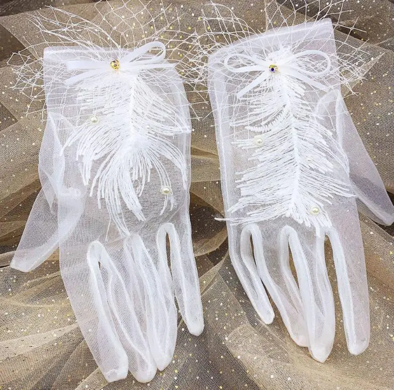 

Women's elegant white color pearl beaded tassel mesh glove female spring summer sunscreen lace glove R2806