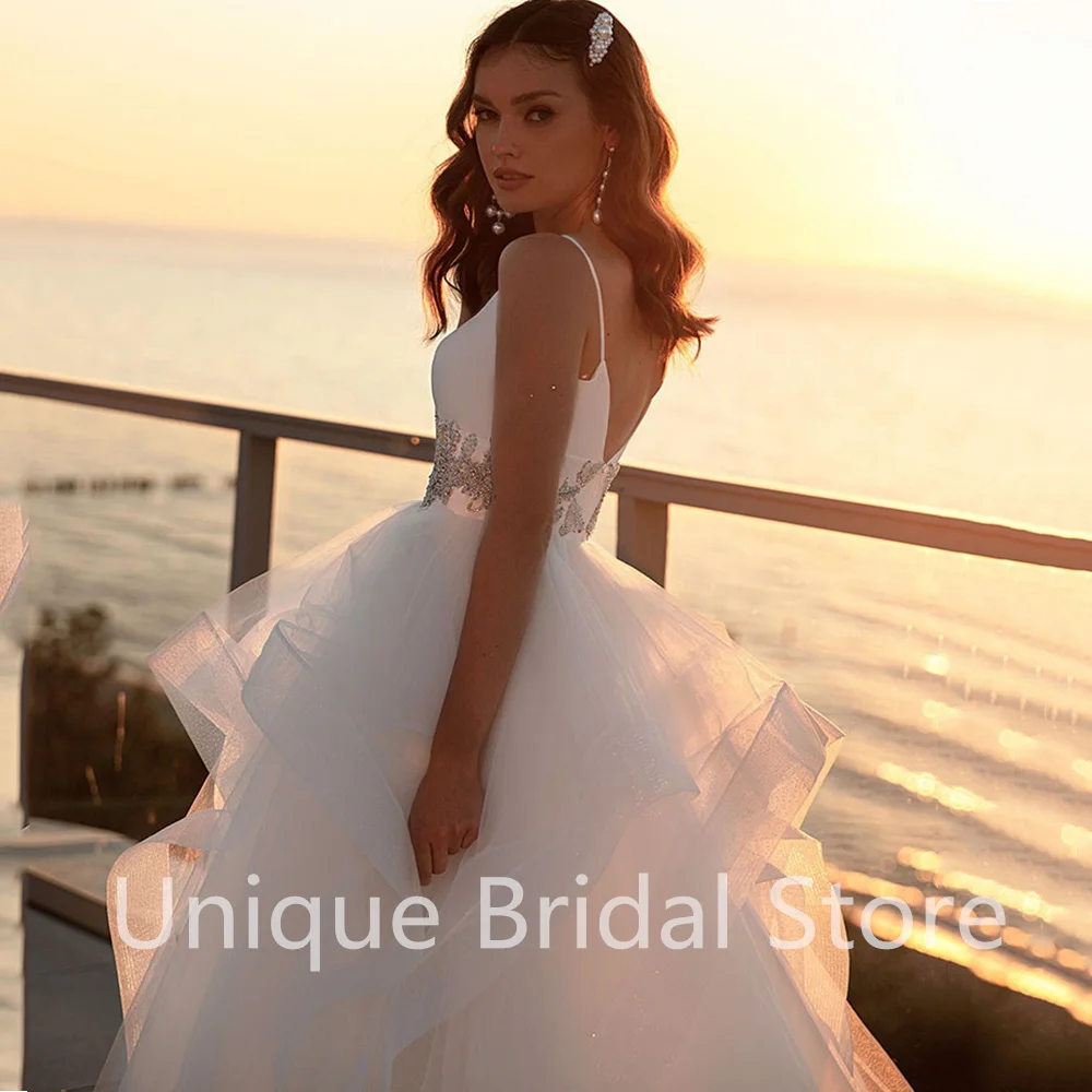 

Charming Sleeveless Wedding Dress V-Neck Backless Spaghetti Straps A-Line Crystal Bridal Gowns 2021 Vestido De Noiva