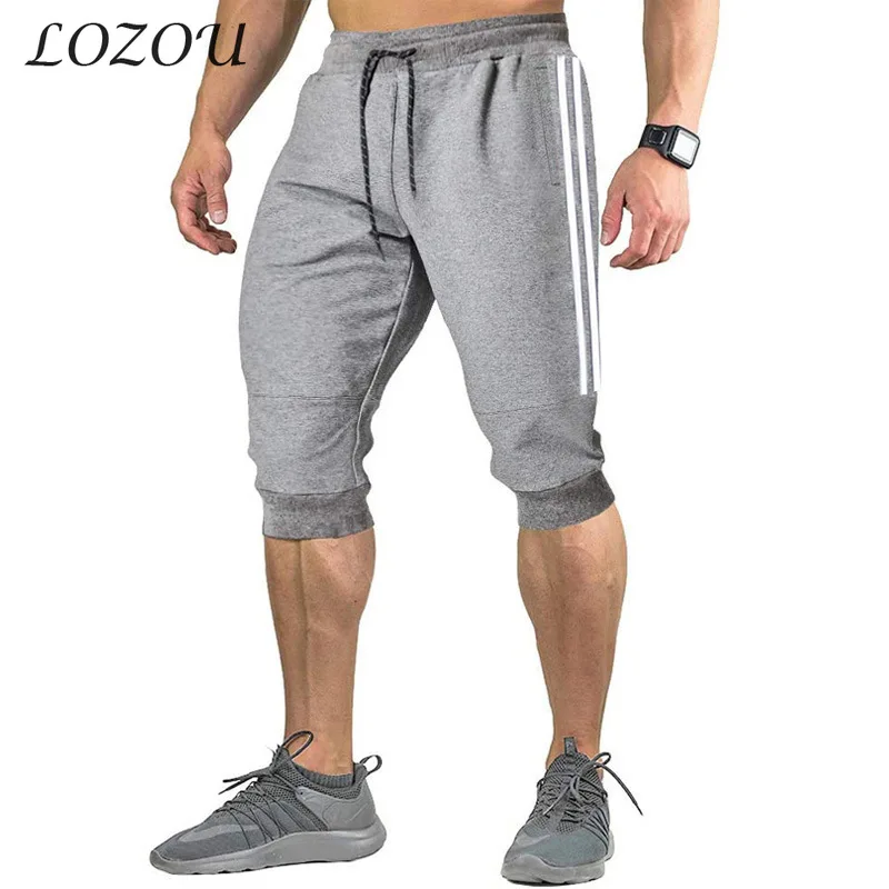 

Лето 2021, модные мужские облегающие пятиконечные брюки, эластичные тренировочные брюки с кулиской, повседневные шорты, одежда, свободные спо...