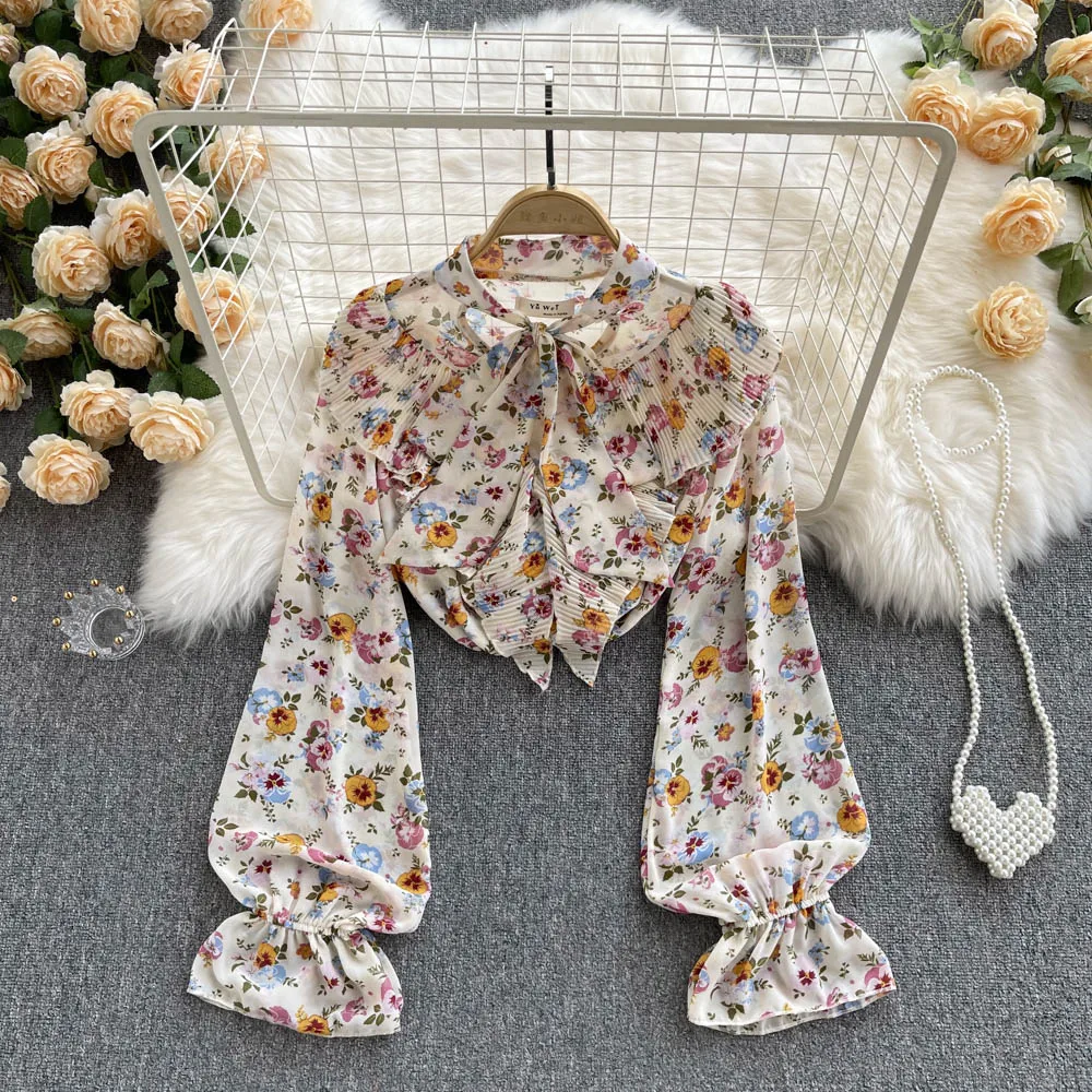 

Женская ажурная рубашка с воротником-стойкой и бантом