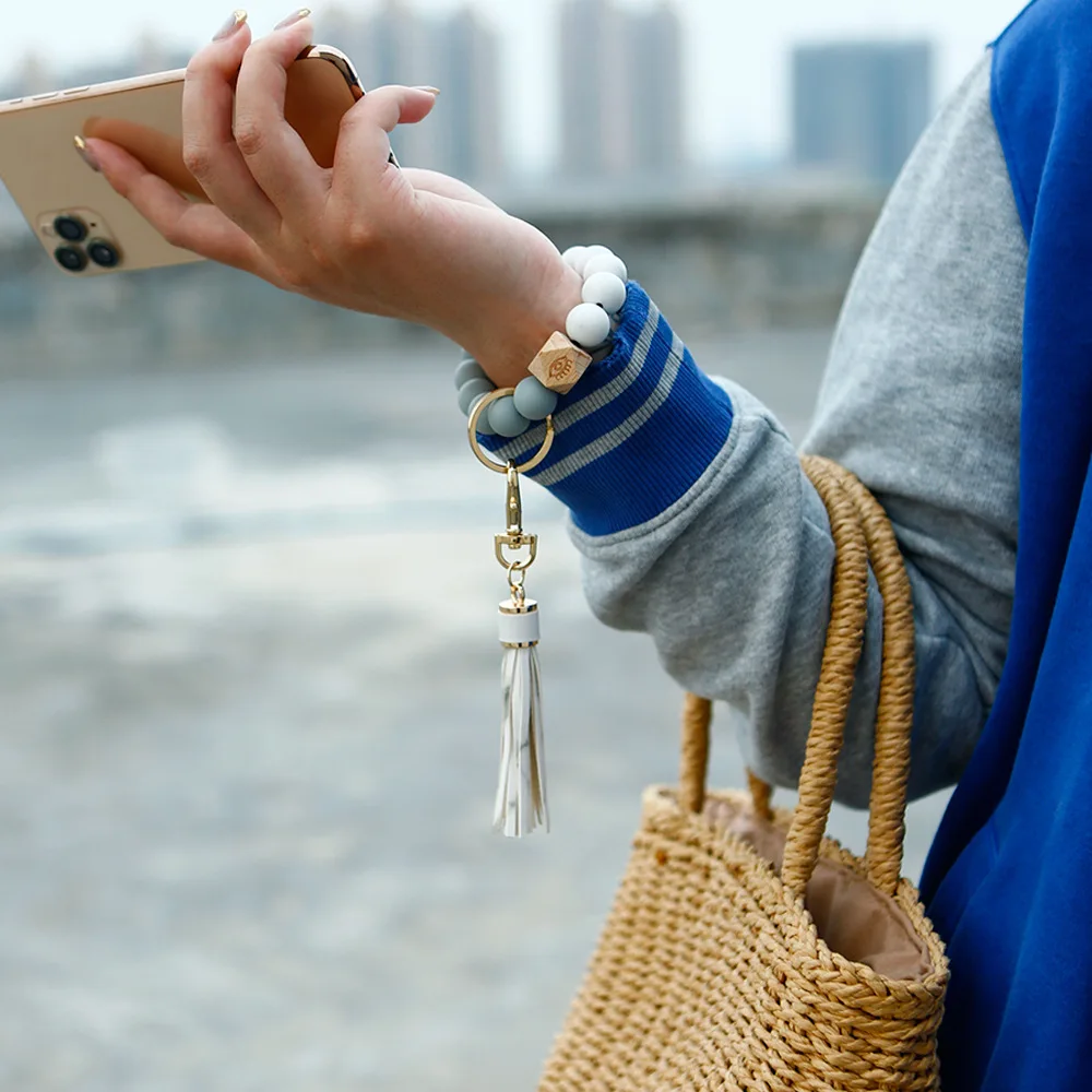 

2021 Creative Summer Silicone Bead Wrist Keychain Europe and America Wooden Bead Tassel Anti-lost Key Ring Pendant